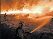  ?? MARK RALSTON/GETTY-AFP ?? The Mendocino Complex inferno, which is actually two blazes, has burned past fire lines near Upper Lake, Calif.