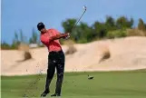  ?? GETTY IMAGES ?? Tiger Woods is back putting his irons to the use for which they were intended.