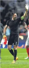  ??  ?? Veteran keeper Gianluigi Buffon celebrates a clean sheet in Monaco.