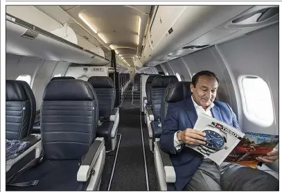  ?? NWA Democrat-Gazette/BEN GOFF ?? United Airlines CEO Oscar Munoz sits Wednesday in the first-class section of a Bombardier CRJ-550 at Northwest Arkansas Regional
Airport in Highfill.