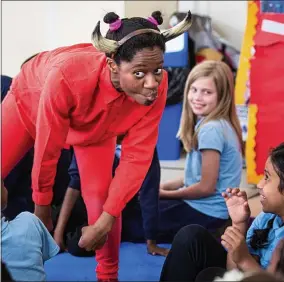  ??  ?? Play time: actress Kezrena James performs to schoolchil­dren on the Primetime tour