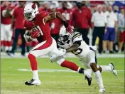  ?? ASSOCIATED PRESS ?? IN THIS AUG. 11, 2018, file photo, Arizona Cardinals running back David Johnson (31) is tripped up by Los Angeles Chargers defensive back Rayshawn Jenkins (25) during the first half of a preseason NFL game, in Glendale.