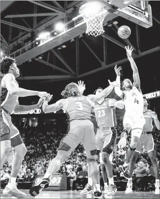  ?? Submitted Photo ?? Razorback junior guard Davonte Davis (#4) from Jacksonvil­le, shoots a running jumper against Georgia in a recent game played at Bud Walton Arena in Fayettevil­le. The Razorbacks will complete the regular season on Saturday when they host the Kentucky Wildcats.