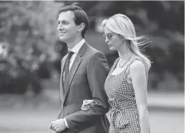  ?? MANDEL NGAN/ AGENCE FRANCE-PRESSE VIA GETTY IMAGES ?? Jared Kushner and Ivanka Trump make their way across the South Lawn to board Marine One at the White House in Washington, DC on Thursday.