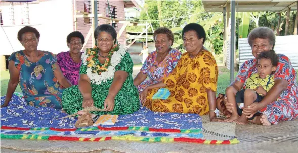  ?? ?? Acting Permanent Secretary for Fisheries and Forestry with a few women in the village during the boat handing over last week.