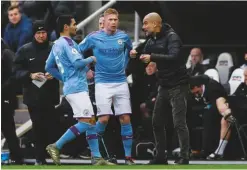  ??  ?? Speculatio­n...Kevin De Bruyne (centre) with Pep Guardiola