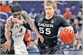  ?? Getty Images ?? ALL FOR ONE: J.P. Macura helped lead No. 11 Xavier over Florida State and into the Sweet 16 on Saturday.