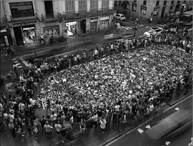  ??  ?? People gather at an impromptu memorial where a van crashed into pedestrian­s at Las Ramblas in Barcelona, Spain August 24, 2017. (Photo:Reuters)