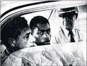  ?? JOHN BOSS/THE ADVOCATE 1964 ?? Henry Montgomery, flanked by two deputies, awaits the verdict in his trial for the slaying of deputy Charles Hurt.