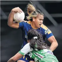  ?? PHOTO: PETER MCINTOSH ?? No way through . . . Otago Spirit second fiveeighth Kilisitina Moata’ane is tackled by Manawatu lock Kahurangi Sturmey during their Farah Palmer Cup match at Forsyth Barr Stadium yesterday.