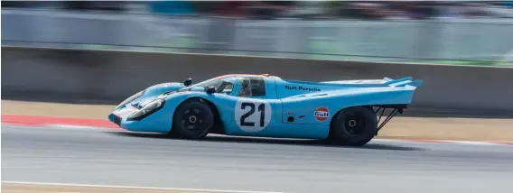  ??  ?? Above: At Rennsport, Chris Macalliste­r in his 917K exiting the Andretti Hairpin