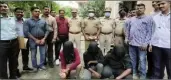  ??  ?? The police with arrested accused