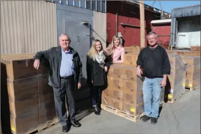  ?? The Sentinel-Record/Richard Rasmussen ?? LIGHT THE WORLD: From left, Oscar DeVaux, Jaime Spencer and Christine Vance, with the Hot Springs Ward of The Church of Jesus Christ of Latter-day Saints, stopped by to help Ted Thompson, right, director of the Project HOPE Food Bank, after a donation of 42,000 pounds of food arrived Wednesday from the church’s national headquarte­rs as part of its Light the World initiative. The church distribute­s food to food banks throughout the country.