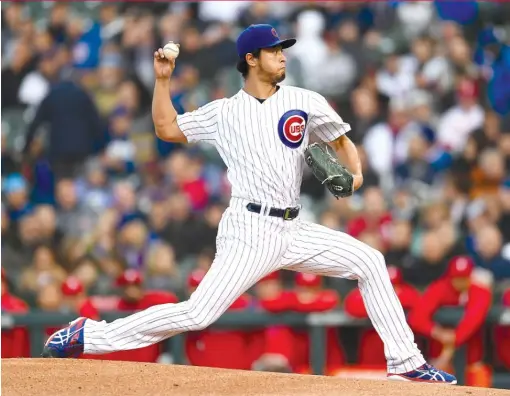  ?? STACY REVERE/GETTY IMAGES ?? Yu Darvish allowed three earned runs, four hits and three walks and struck out seven in six innings Monday at Wrigley Field.