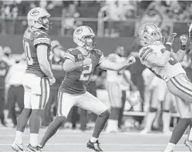  ?? LM Otero / Associated Press ?? Packers kicker Mason Crosby (2) watches his 51-yard field goal give Green Bay its 34-31 win over the Cowboys as time expires Sunday at AT&T Stadium.