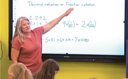  ?? GENE J. PUSKAR/AP ?? Elementary math teacher Margie Howells teaches a fifth grade class in West Virginia. The latest scores from the Nation’s Report Card and Northwest Evaluation Associatio­n show math scores hitting the lowest level in decades and pandemic recovery efforts stalling.