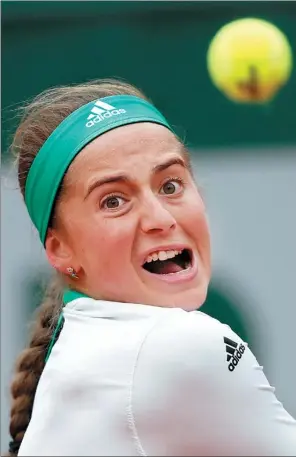  ?? GONZALO FUENTES / REUTERS ?? Jelena Ostapenko hits a return to Caroline Wozniacki in their French Open quarterfin­al at Roland Garros in Paris on Tuesday. The unseeded 19-year-old won 4-6, 6-2, 6-2 to become the first Latvian woman to reach the last four of a Grand Slam.