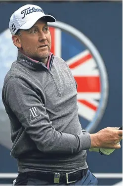  ??  ?? Ian Poulter tees off on the 15th hole. Picture: Getty.