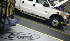  ?? LUKE SHARRETT/BLOOMBERG FILES ?? A Moody’s report says a proposed tariff would leave U.S. car manufactur­ers like Ford Motor Co. vulnerable because so many vehicles sold in the U.S. are imported from Canada and Mexico.