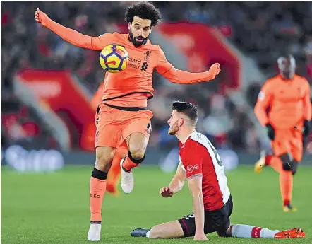  ?? — AFP ?? Liverpool’s Mohamed Salah controls the ball in their English Premier League match against Southampto­n at St Mary’s Stadium on Sunday. Liverpool won the match 2-0.