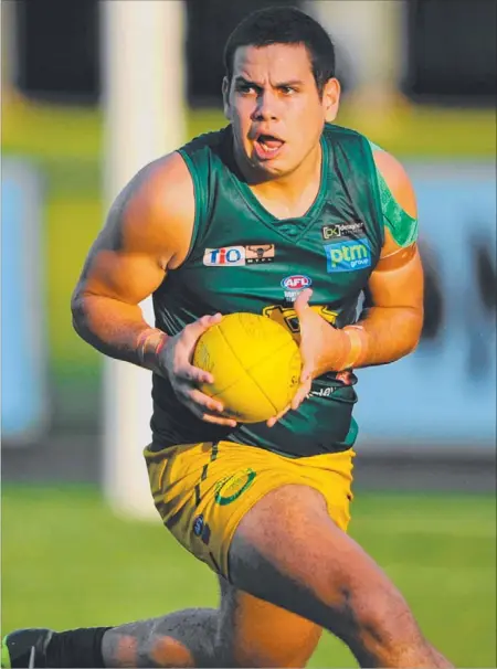  ?? Picture: HELEN ORR ?? Jack Long on the rampage for St Marys as he looks for a teammate downfield during yesterday’s NTFL premiershi­p clash against Nightcliff at TIO Stadium