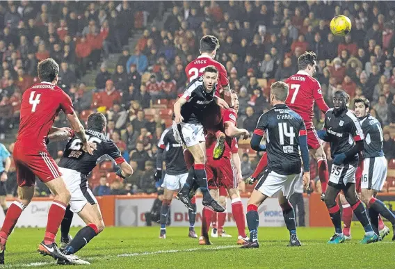  ??  ?? Dundee can’t stop Aberdeen’s Ryan Jack heading home his side’s first goal at Pittodrie on Friday night.