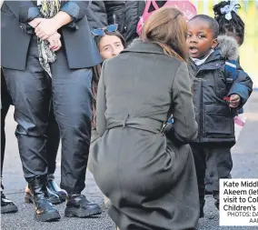  ?? PHOTOS: DANIEL LEAL AND AARON CHOWN/PA ?? Kate Middleton meets Akeem (left) during her visit to Colham Manor Children’s Centre