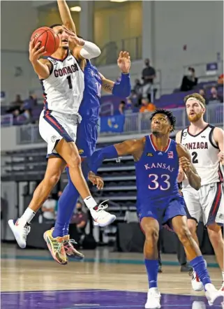  ?? DOUGLAS P. DEFELICE/GETTY IMAGES ?? Jalen Suggs (1) scored 24 points in a season-opening victory against Kansas on Nov. 26, 2020, in Fort Myers, Fla. The Bulldogs have been rolling ever since.