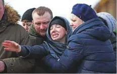  ?? Reuters ?? ■ Relatives wail during a funeral of a victim of the shopping mall fire in Kemerovo, Russia, yesterday.