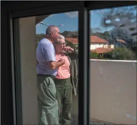  ?? OHAD ZWIGENBERG/ASSOCIATED PRESS ?? Pete and Gillian Brisley visit the home of their daughter, who was killed along with her two daughters in Hamas’ Oct. 7 attack, and their son-in-law, who was taken captive, in Kibbutz Be’eri, southern Israel, Wednesday, Feb. 21, 2024.