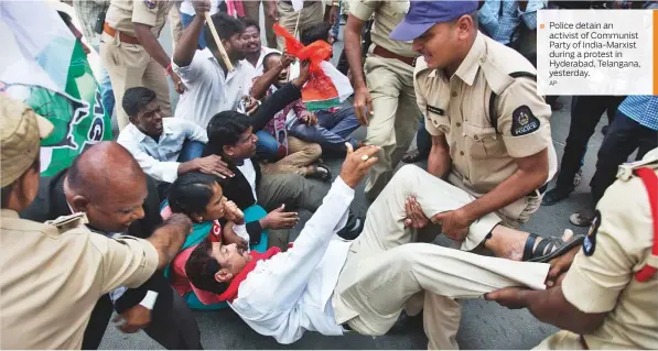  ?? AP ?? Police detain an activist of Communist Party of India-Marxist during a protest in Hyderabad, Telangana, yesterday.