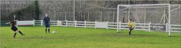  ??  ?? Darren Jordan tucks away a penalty for Carnew B against Arklow Celtic B.