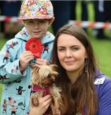  ??  ?? Rion and Killian Bunyan (Killarney) with their dog Bonnie at the Bikefest Dog Show. Photo by Don MacMonagle.