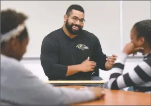  ?? (File Photo/AP/Steve Ruark) ?? Urschel teaches a lesson at Dundalk High School to launch the Texas Instrument­s program in Baltimore in July 2017.