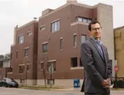  ?? ?? Property owner Robert Kahn across from a house he rents out in Roscoe Village on Dec. 10.