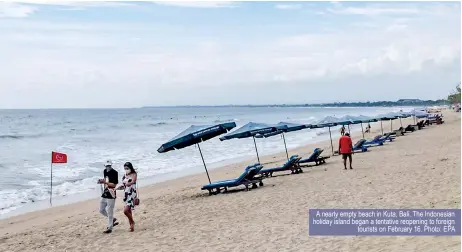  ?? ?? A nearly empty beach in Kuta, Bali. The Indonesian holiday island began a tentative reopening to foreign tourists on February 16. Photo: EPA