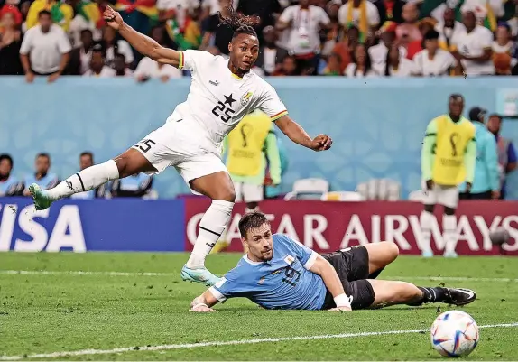  ?? Elsa Garrison/Getty Images ?? > Bristol City’s Ghana striker Antoine Semenyo goes for goal during his side’s 2-0 World Cup defeat to Uruguay yesterday – See Page 55