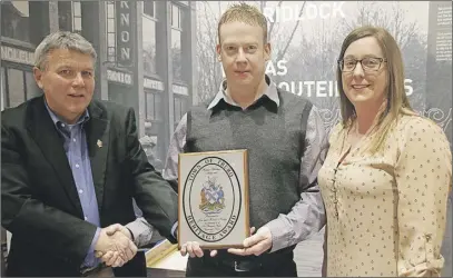  ?? lynn CUrwin/TC Media During Heritage Night celebratio­ns at the Colchester Historeum Truro Mayor Bill Mills presented Jon and Kenzie Keddy with the Town of Truro Heritage Award for the renovation of Carriage House (64 Pleasant Street). ??