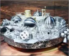  ?? UWE ANSPACH/DPA VIA AP ?? A model of Schiaparel­li, the Mars landing device, is on display at the European Space Agency in Darmstadt, Germany Wednesday.