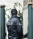  ?? OZAN KOSE/AFP/GETTY IMAGES ?? A Turkish police officer enters the Saudi consul’s residence while investigat­ing the disappeara­nce of Jamal Khashoggi.