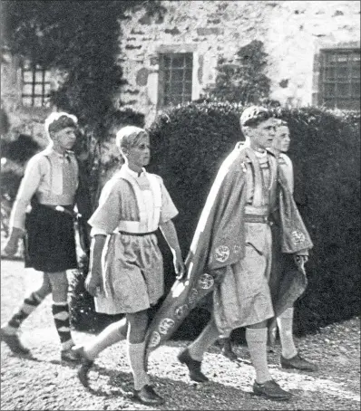  ??  ?? 12-year-old Prince Philip, second left, takes part in a pageant at Gordonstou­n School in Moray in 1933