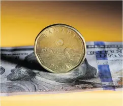  ?? BRENT LEWIN / BLOOMBERG FILES ?? A median forecast in a Bloomberg analysts’ survey shows the loonie appreciati­ng to $1.25 per U.S. dollar by the end of next year from current levels around $1.30.