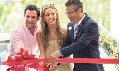  ??  ?? Sandals Royal Barbados’s General Manager Fernand Zievinger (right), welcomes Shaunagh and Thomas Anderson as his very first guests when the resort opened its doors on December 20, 2017.