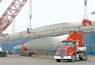  ?? File photo / San Antonio Express-News ?? Texas is the nation’s largest producer of wind-driven energy and is gaining an increasing share of ERCOT’s market, producing 17.4 percent of power in 2017, up from 15.1 percent in 2016. Here, turbine blades arrive at the Port of Corpus Christi in 2017.