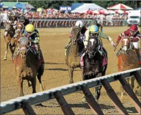  ?? PHOTO SPENCER TULIS ?? Sombeyay (left) wins the 104th Running of the Sanford for 2-year-olds at Saratoga Race Course Saturday.