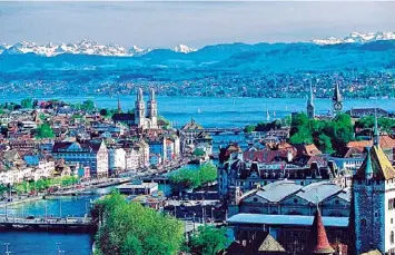  ??  ?? The pristine Lake Zurich and the shimmering Swiss Alps add a special charm to this town