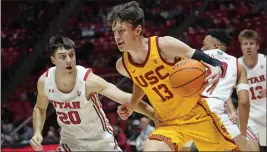  ?? RICK BOWMER – THE ASSOCIATED PRESS ?? USC guard Drew Peterson, who scored 23points, drives as Utah’s Lazar Stefanovic defends.
