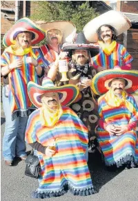  ??  ?? A group called The Gringos taking part in the beer walk in Higher Crompton