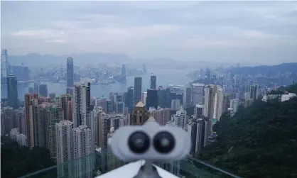  ??  ?? The view from The Peak district of Hong Kong where scammers preyed on a wealthy 90-year-old woman. Photograph: Lam Yik/Reuters