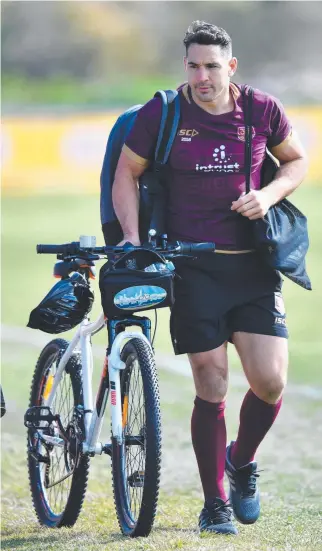  ?? WHEELS IN MOTION: Billy Slater arrives at Maroons training at Sanctuary Cove yesterday. ??